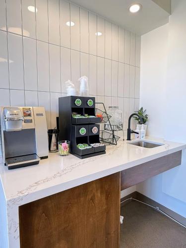 a kitchen with a counter top with a sink at The Alice Hotel in Tucson