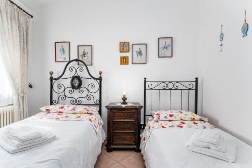 Ένα ή περισσότερα κρεβάτια σε δωμάτιο στο Residenza le Magnolie