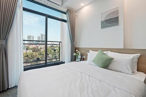 Hanoi Cosmos Hotelにあるベッド