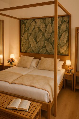 a bedroom with a bed with a painting on the wall at Isola Memmia in Padova