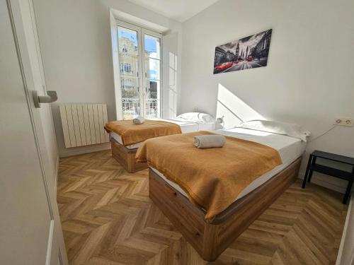 Postel nebo postele na pokoji v ubytování Apartamentos Ciudadela Superior 3000