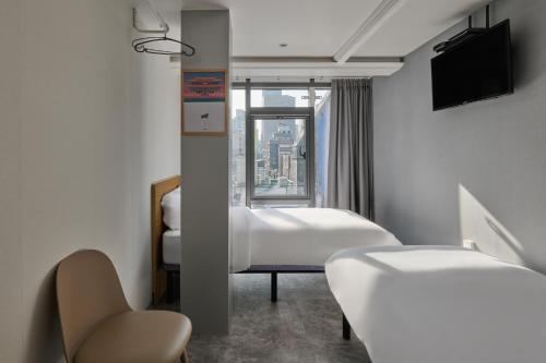 Postel nebo postele na pokoji v ubytování L hostel