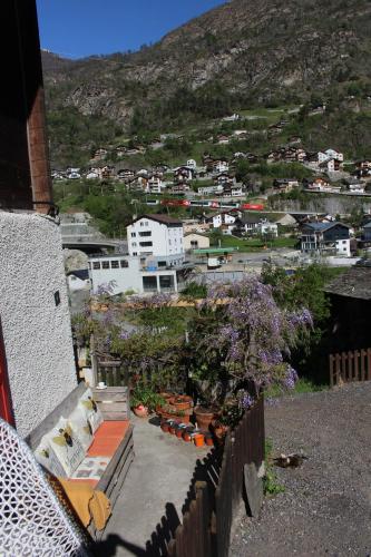 a view of a town from a balcony of a building at Chalet Chinegga in Stalden