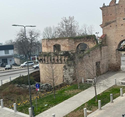 an old brick building on the side of a street at Appartamento Il Loftino in Forlì
