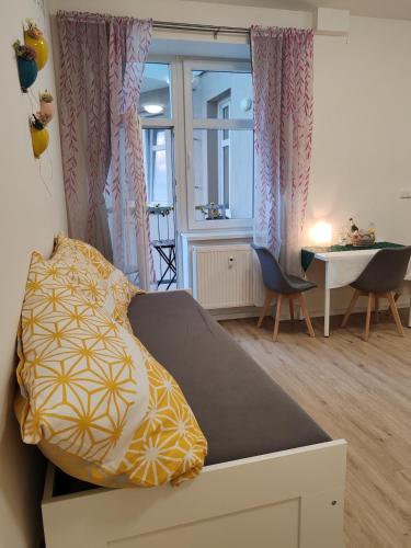 a room with a bed and a table and a window at Star #2C215 in Golčŭv Jeníkov