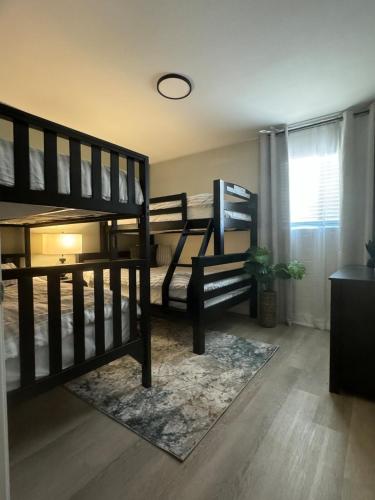 two sets of bunk beds in a room at Entire House near DTLV in Las Vegas