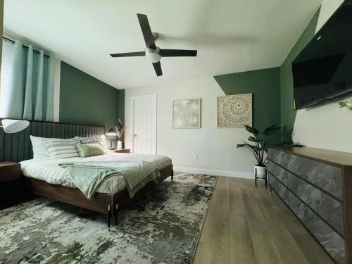 a bedroom with a bed and a ceiling fan at Entire House near DTLV in Las Vegas