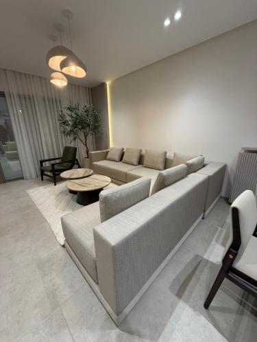 a living room with a couch and a table at Appartement in Sidi Daoud