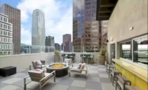a balcony with chairs and a table on a building at Downtown Los Angeles Gem 2 in Los Angeles