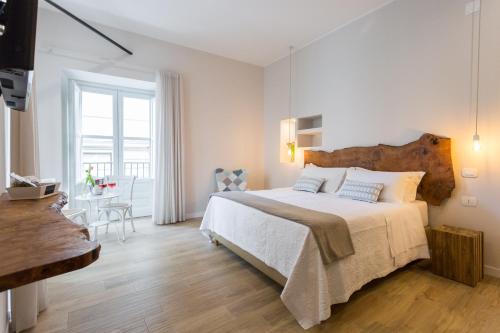 Una cama o camas en una habitación de Bellaroto Suite & SPA