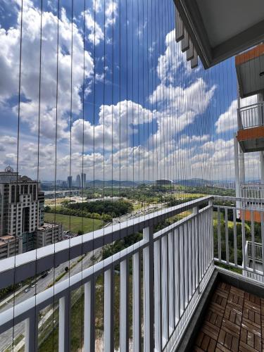 a view from the balcony of a building with glass windows at Homely Stay by MySky Stays at Presint 5, Putrajaya in Putrajaya