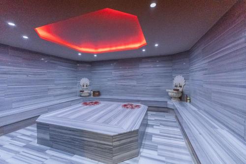 a room with a bed in the middle of it at Askoc Hotel & SPA in Istanbul