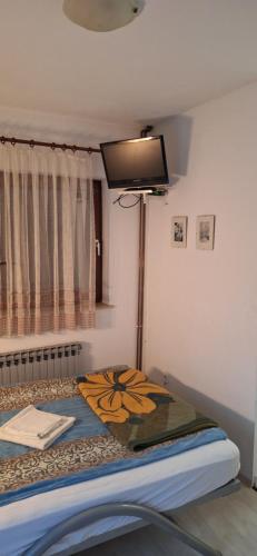 Postel nebo postele na pokoji v ubytování Mirna Noć - Apartman