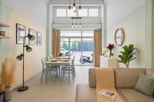 a living room with a couch and a table at GM5 - Cozy Apartment 8pax, Ladprao, MRT&BTS in Bangkok