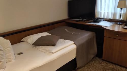 Postel nebo postele na pokoji v ubytování Tandreas Hotel & Restaurant
