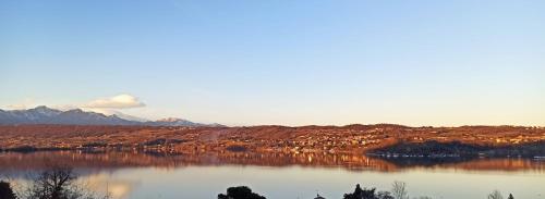 a view of a lake with mountains in the background at The Lake House in Viverone