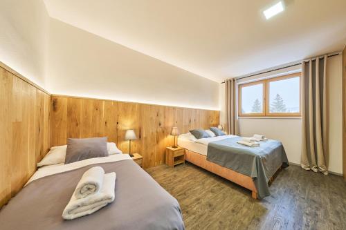 Ένα ή περισσότερα κρεβάτια σε δωμάτιο στο Hotel Obzor