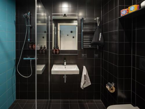 a bathroom with a sink and a mirror at The Social Hub Rome in Rome