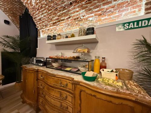 a buffet in a store with food on it at CC Opera Suites in Madrid