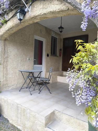 a table and chairs sitting on a patio at La Lavande in La Robine