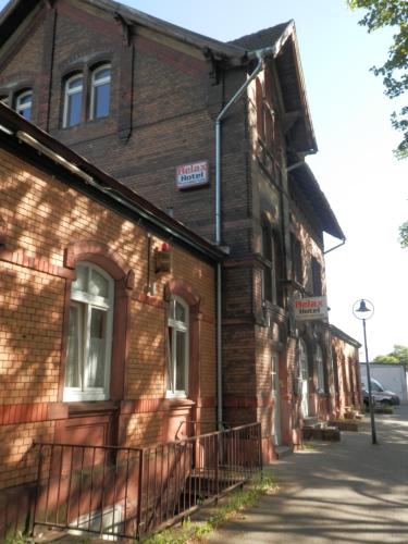 an old brick building with a sign on it at Relax Hotel-Ludwigshafen in Ludwigshafen am Rhein