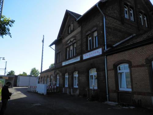 a man standing outside of a brick building at Relax Hotel-Ludwigshafen in Ludwigshafen am Rhein