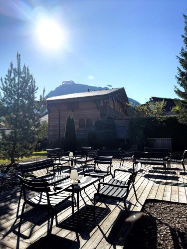 a group of tables and chairs on a patio at Hotel Bel'alpe in Morzine