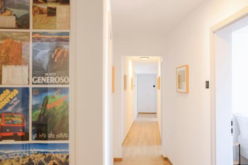 a hallway with white walls and a hallway leading into a room at Bed & Breakfast alle Cantine in Salorino