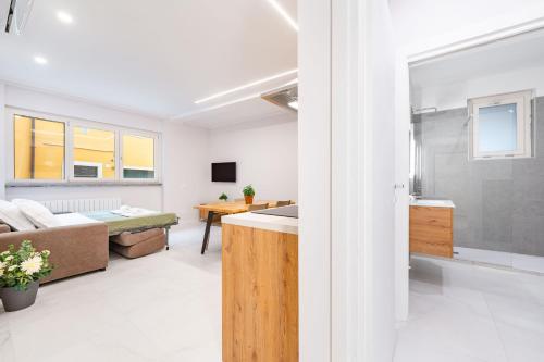 a living room with a couch and a table at Borgo Trento Residence in Verona