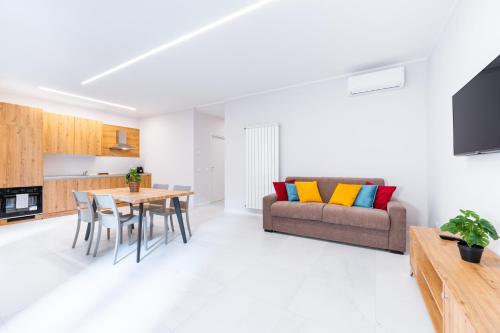 a living room with a couch and a table at Borgo Trento Residence in Verona