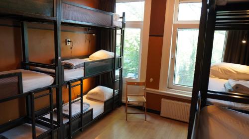 Postel nebo postele na pokoji v ubytování Onefam Amstel