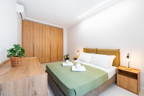a bedroom with a bed with two towels on it at Borgo Trento Residence in Verona