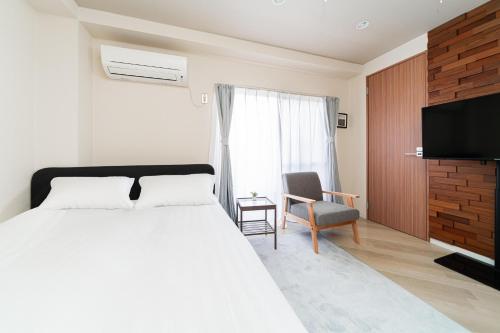 Et tv og/eller underholdning på Luce Ikebukuro - Cozy APT Stay in Ikebukuro Tokyo, with Direct Access to Shinjuku & Shibuya