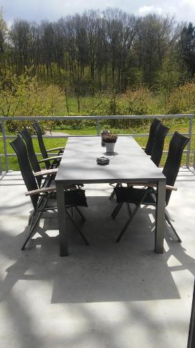 a table and chairs sitting on a patio at erve Hanebulten in Haaksbergen
