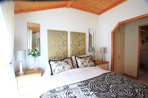 a bedroom with a large bed in a room at Country Retreat in Guildford