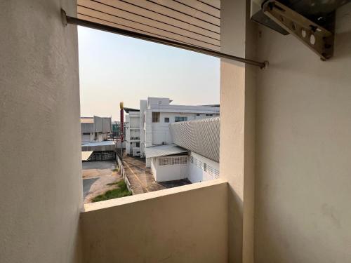 a view from a window of a building at Jamjuree Place in Ban Si Than