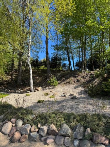 a pile of rocks and trees on a hill at Dream Vila Trakai in Trakai