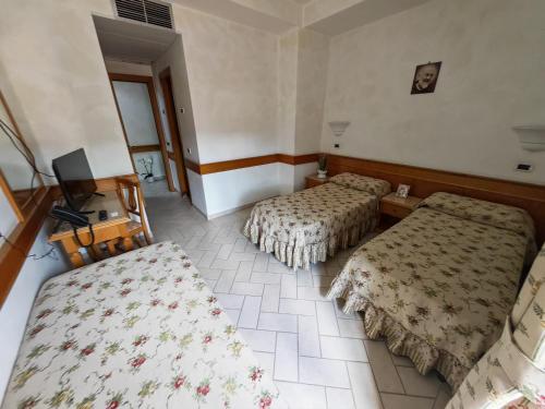 Ένα ή περισσότερα κρεβάτια σε δωμάτιο στο Hotel Pace
