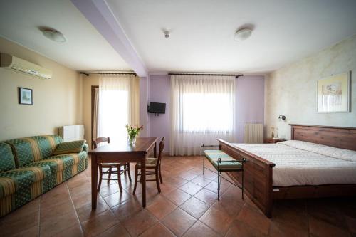 Ένα ή περισσότερα κρεβάτια σε δωμάτιο στο Agriturismo San Bartolomeo