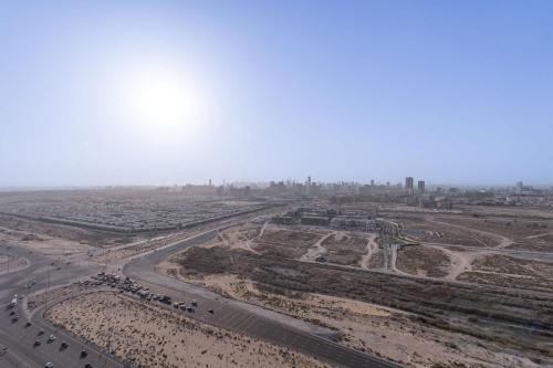 an aerial view of a desert with a highway at Beautifully Furnished Studio with Skyline Views in Dubai Marina