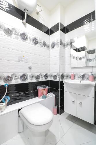a bathroom with a white toilet and a sink at B&B Italia in Ercolano
