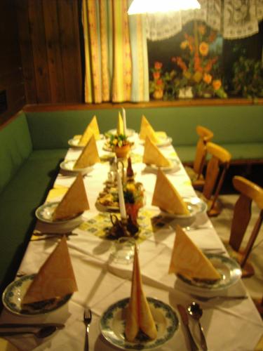 a long table with plates of food on it at Annaberger Musikantenwirt in Annaberg im Lammertal