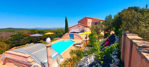an aerial view of a house with a swimming pool at LOFT L'Olivier in Llauro