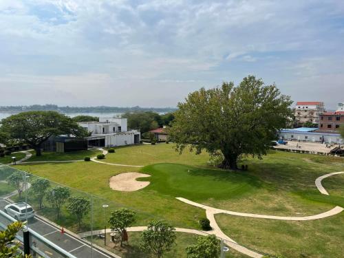 a view of a park with a tree and grass at Condo Hotel apartment for rent in Phnom Penh City in Phnom Penh