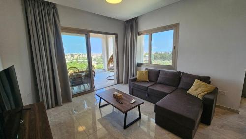 a living room with a couch and a table at Suburban Escape in Limassol