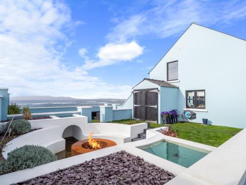 a view of the backyard of a house with a swimming pool at Ocean Mist in Carna