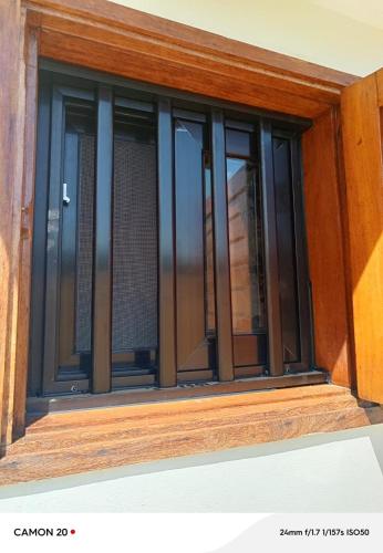 a window of a building with glass at chambre indépendante in Cap Skirring