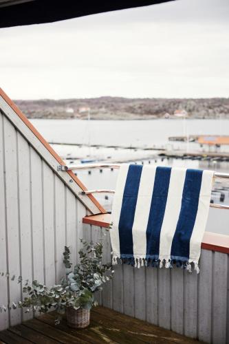 a blue and white towel sitting on the side of a boat at Villa Marstrand in Marstrand