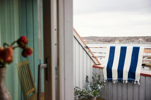 a towel is hanging on the railing of a balcony at Villa Marstrand in Marstrand