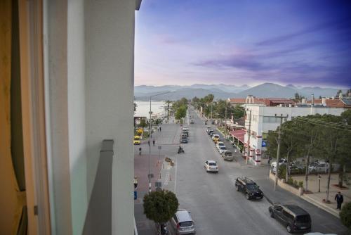 a view of a city street with cars on the road at Yeniceri City Hotel in Fethiye